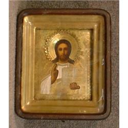 Une icône russe du 19e Siècle représentant un Christ en majesté, reza en métal doré....