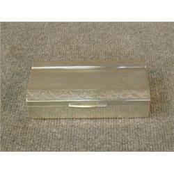 Une boîte guillochée en argent continental à décor de fleurs.  A Continental sterling silver engi...