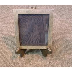 Un encadrement de photo américain en argent gravé....