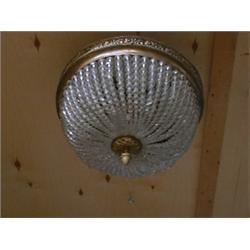 Un plafonnier en métal doré et cristal taillé.  A gilt metal and cut crystal ceiling fixture. $70...