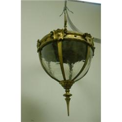 Une lanterne ovoïde en bronze doré.  A gilt bronze egg shaped lantern.  H./H. 23" - 58cm. $800/12...