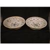 Image 1 : Un ensemble de quatre plats creux décorés de fleurs à quatre pétales dans une bordure de brindill...