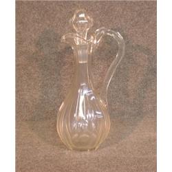 Une carafe en cristal taillé.  A cut crystal decanter. $150/250...