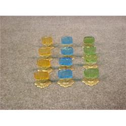 Un ensemble de 12 marque-places en verre de couleur gravé de danseuses, monture en laiton....