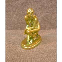 Une figurine de Zsolnay représentant un nu agenouillé.  A Zsolnay figure of a kneeling nude. $300...