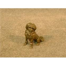 Un sujet en bronze patiné représentant un caniche.  A patinated bronze figure of a poodle. $275/3...