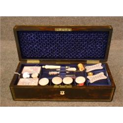 Un nécéssaire à couture en nacre dans un écrin en ébène de Macassar à filets d'ivoire, signé: "Lu...