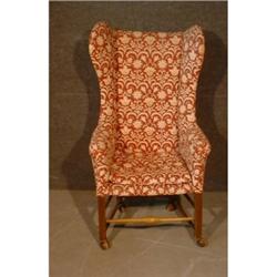 Une bergère à oreillettes du milieu du 19e Siècle, sur des pieds droits réunis par une entretoise...