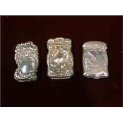 Un lot de 3 étuis à allumettes américains Art Nouveau en argent....