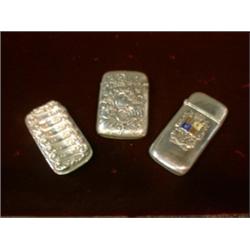 Un lot de 3 étuis à allumettes américains en argent.  A lot of 3 American sterling silver vesta c...