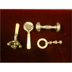 Un lot de 4 hochets en argent.  A lot of 4 sterling silver rattles. $125/175...