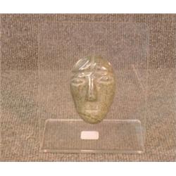 Une sculpture inuit en stéatite  représentant un masque.  An Inuit stone carving of a mask. $125/...