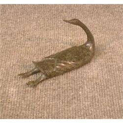 Une sculpture inuit en stéatite représentant une oie, signée.  An Inuit stone carving of a goose,...