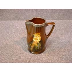 Un broc à eau en porcelaine Kingsware de Royal Doulton:" It is hard for an empty bag to stand upr...