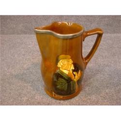 Un broc à eau en porcelaine Kingsware de Royal Doulton:" Would you know the value of money?  Try...