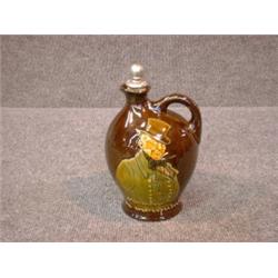 Un broc en porcelaine Kingsware de Royal Doulton:"Micawber, the ever-expectant", avec son bouchon...