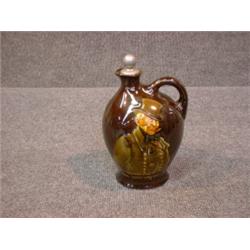 Un broc en porcelaine Kingsware de Royal Doulton:"Micawber, the Ever-Expectant", avec son bouchon...