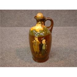 Un broc en porcelaine "Kingsware" de Royal Doulton décoré d'un rabatteur écossais et d'un pêcheur...