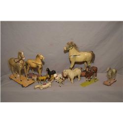 Selection of vintage and antique toys including papier mache, metal and chalkware horses and pull to