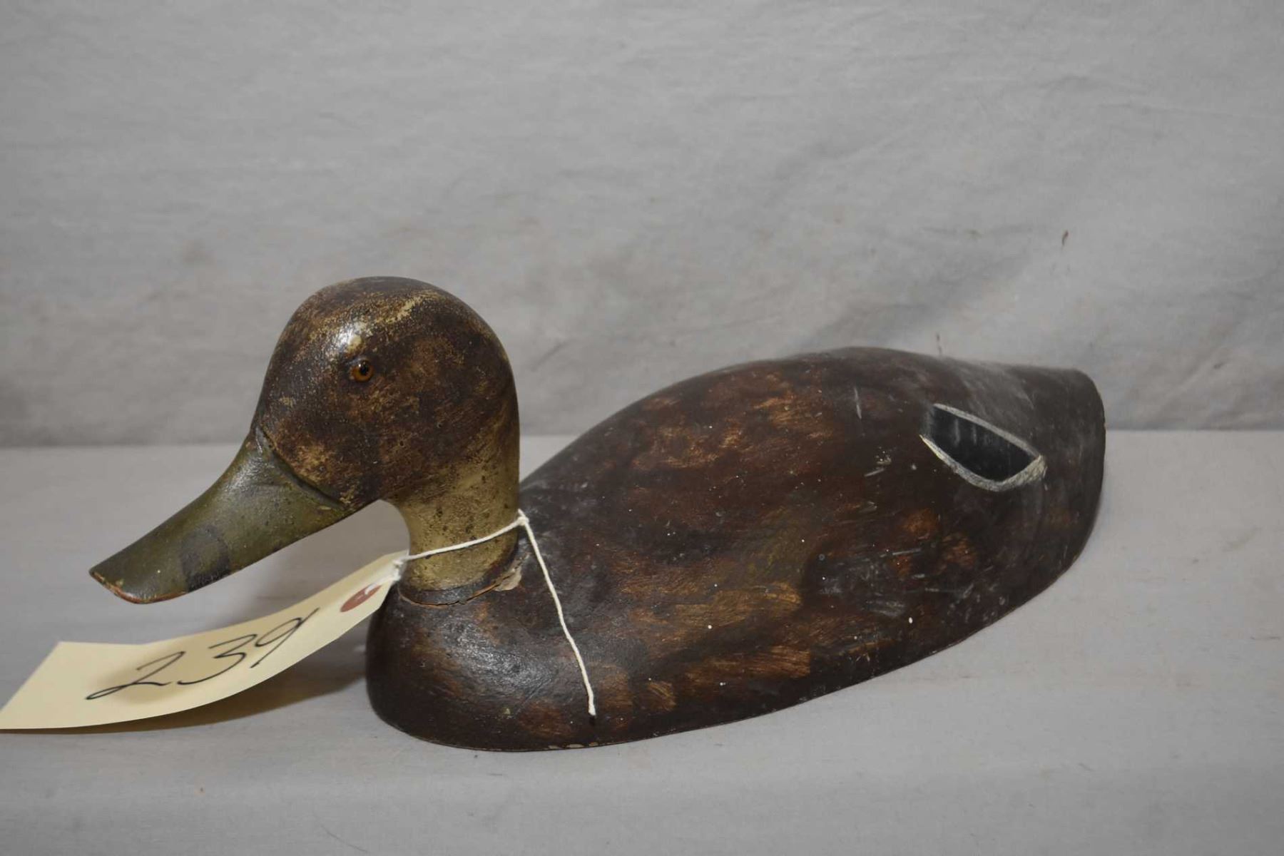 Antique hand carved wooden duck decoy with glass eyes, 12 1/2" in