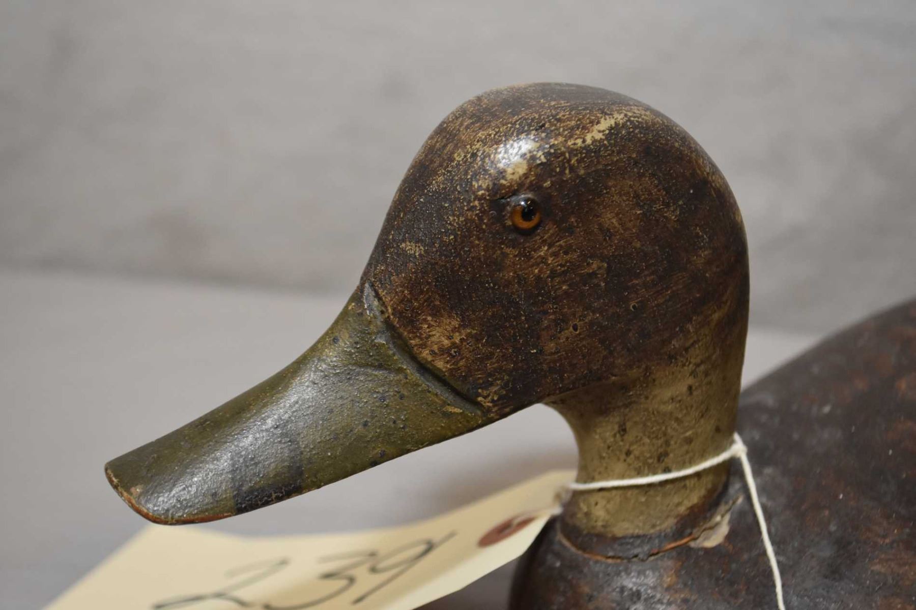 Antique hand carved wooden duck decoy with glass eyes, 12 1/2" in