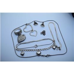 Selection of sterling silver jewellery including lockets, chains with pendant, heart shaped earrings