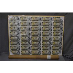 Uncut sheet of twenty five1973Canadian one dollar bills with original shipping tub