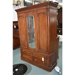 Antique Victorian mahogany wardrobe with four drawer base, two door and a center mirrored panel upp