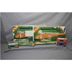 Two vintage boxed German made 1:120 scale train sets plus extra track, engine and five train cars