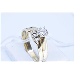 Ladies 14kt yellow gold and diamond solitaire ring set with 0.57ct brilliant white diamond, retail r