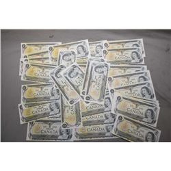 Approximately forty four Canadian $1 bills, lots of consecutive bills