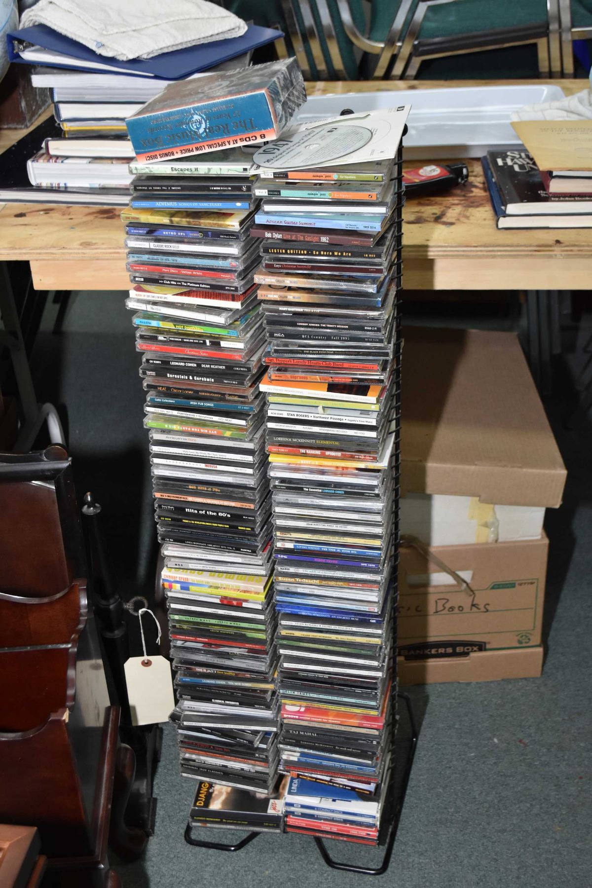 Floor standing wire CD rack loaded with CDs