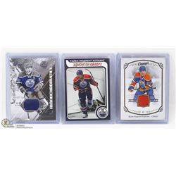 3 RYAN NUGENT-HOPKINS HOCKEY CARDS INCL 2 JERSEY