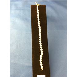 PEARL BRACELET MARKED TIFFANY & CO. TIED WITH 31 PEARLS AND CLOSES WITH A LOBSTER CLASP