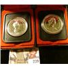 Image 1 : Two Canada Dollars in original cases, 1976 & 1978, Both Silver.