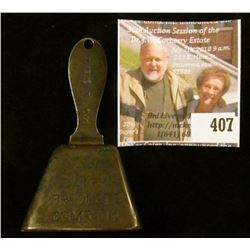 Advertising copper bell – “Ring for the Dairy Products Company” on one side, a cow on opposing long 