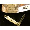 Image 1 : Miniature pocket knife with mother of pearl handle, blade marked GERMANY, total length 2”, blade len