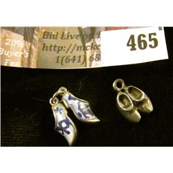 (2) pairs of silver Dutch wooden shoe charms, one with inlaid Delft style enamel. Definitely differe