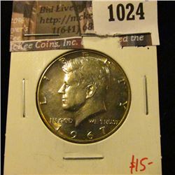 1024 . 1967 Kennedy Half Dollar, BU bulls eye / peripheral toned, v