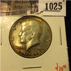 1025 . 1968-D Kennedy Half Dollar, UNC toned, value $10