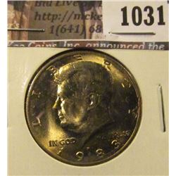 1031 . 1983-P Kennedy Half Dollar, BU toned, struck through grease,