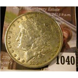 1040 . 1884 Morgan Silver Dollar, VF/XF, value $35
