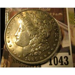1043 . 1886 Morgan Silver Dollar, AU+, value $39