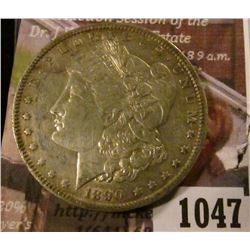 1047 . 1890-O Morgan Silver Dollar, XF/AU, luster with subdued toni