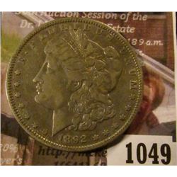 1049 . 1892-O Morgan Silver Dollar, VF, value $40