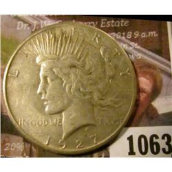 1063 . 1927 Peace Silver Dollar, XF, better date, value $42