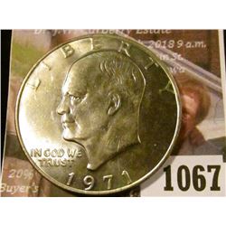 1067 . 1971 Eisenhower Dollar, BU toned, Eisenhower Dollars are HOT
