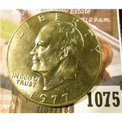 1075 . 1977 Eisenhower Dollar, BU toned from a Mint Set, MS63 value