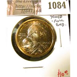 1084 . 2000-P Sacagawea Dollar, BU, obverse toned, original roll en