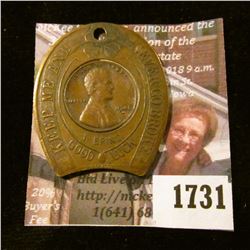 1731 . Encased 1948-D Wheat Cent In A Brass Encasement.  It Says "K